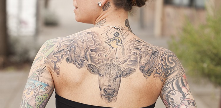 woman's back tattoo featuring a goat