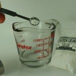 Calcium chloride being measured into water
