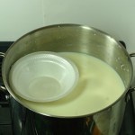 Styrofoam bowl rest on top of milk in pot