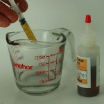 rennet being measured with a plastic syringe