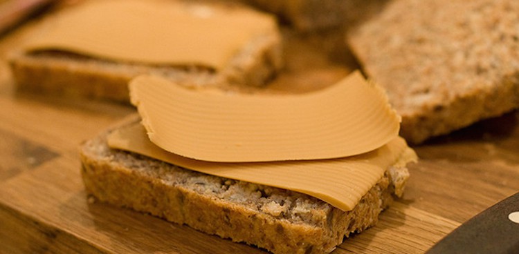 Brunost cheese sliced on brown bread