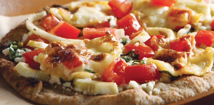 pizza on naan bread with tomatoes and onions