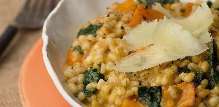 Pearl barley risotto with butternut squash, kale, and hard cheese on top