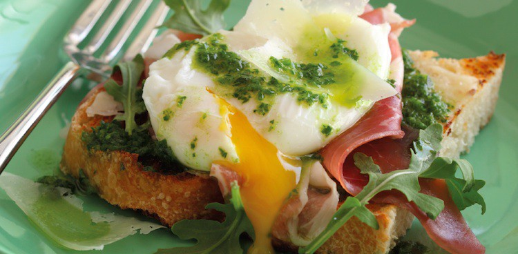 open face breakfast sandwich with poached egg, scallion oil, ham, and arugula
