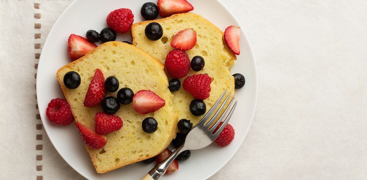 Slices of Spanish yogurt cake dotted with fresh berries