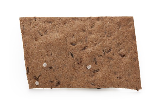 A single caraway rye cracker from Potter's Crackers.
