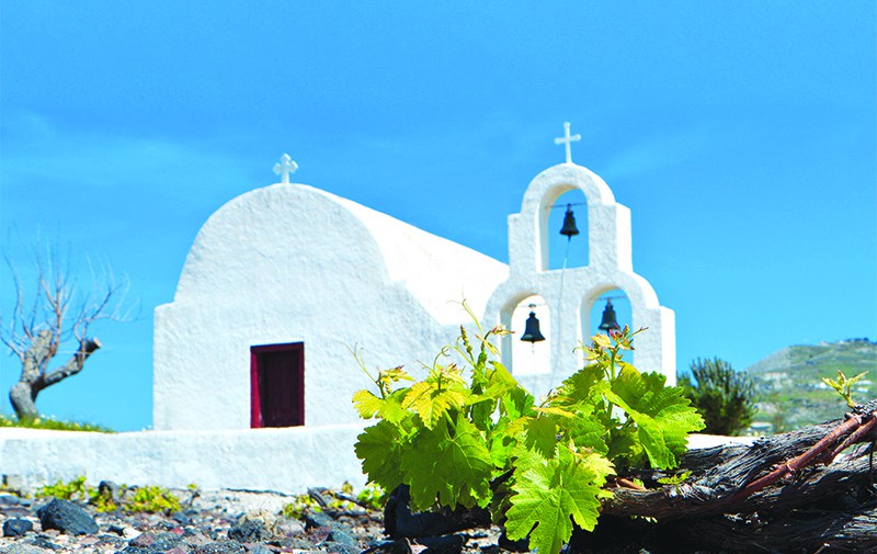 A whitewashed church on an idyllic, sunny Greek day.