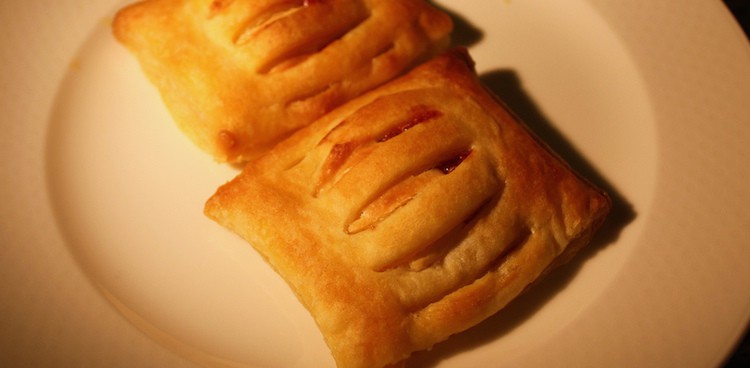 Two Cuban guava pastries known as pastelitos de guayaba on a plate