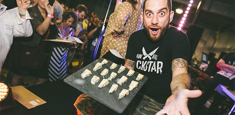 CMI Founder and host Adam Moskowitz keeps the crowd energized and the cheese samples flowing.