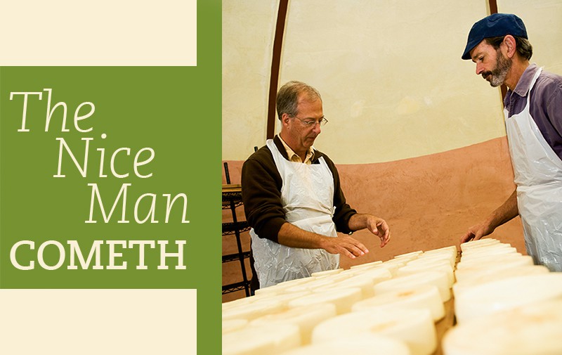 Bob Wills of Cedar Grove helps Willi Lehner of Bleu Mont Dairy of Blue Mounds, Wis., turn wheels of Driftless Select Earth Schmier, made at Cedar Grove and aging here in Bleu Mont Dairy’s underground cave.