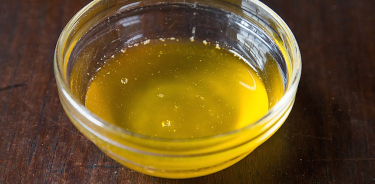 melted clarified butter in glass bowl