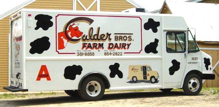 Cow splotched milk delivery truck for Calder Brother's Farm Dairy