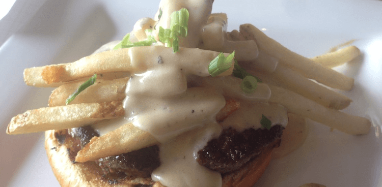 open faced burger topped with poutine