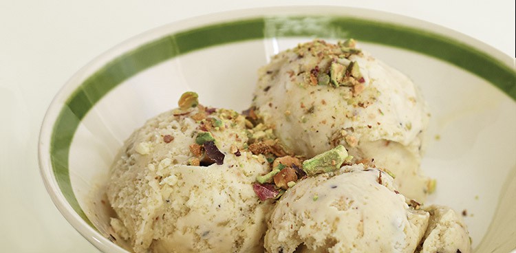 Three scoops of pistachio, honey, ricotta ice cream in a bowl