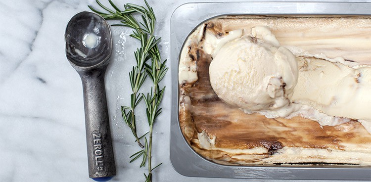 Ice cream made with balsamic and parmesan, with a rosemary garnish by the side