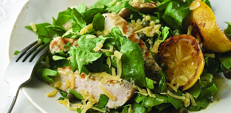 Arugula salad with chicken, grilled lemon, and gouda