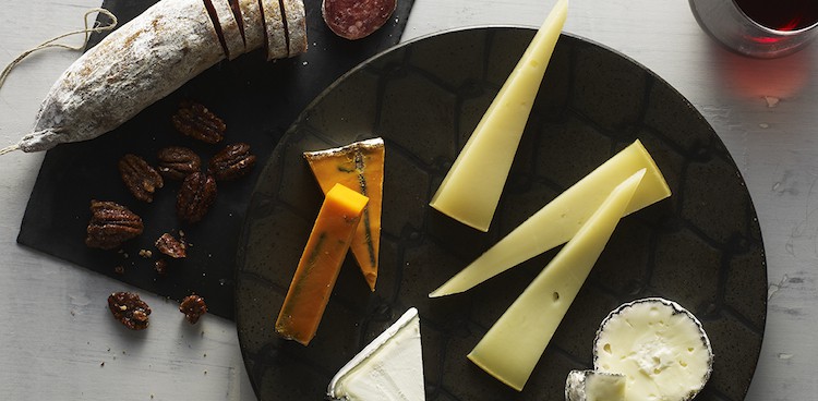 a cheese plate with Bermuda Triangle, Dirt Lover, Red Rock, and Bear Hill cheeses