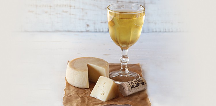 sweet wine (known as a "sticky" in Australia) with a piece of sheep's milk cheese