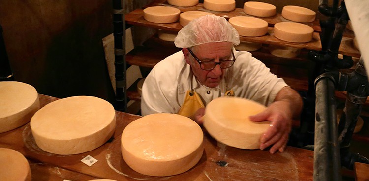 Brother Alberic tends his cheese