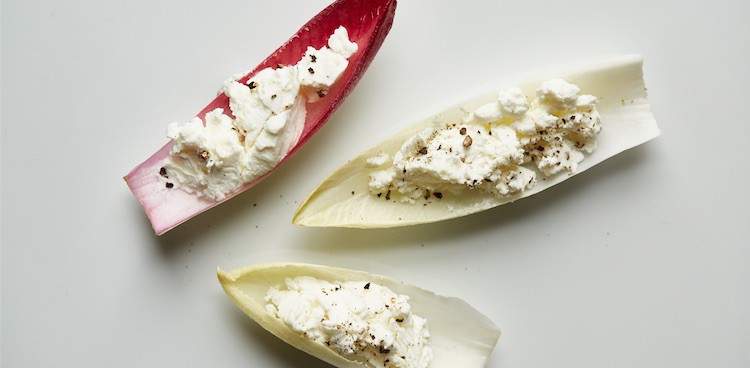 Raw endive leaves filled with fresh chevre and springkled with salt and cracked black pepper
