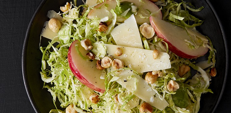 Shaved Brussels sprout salad with hazelnuts, cheddar, and apples