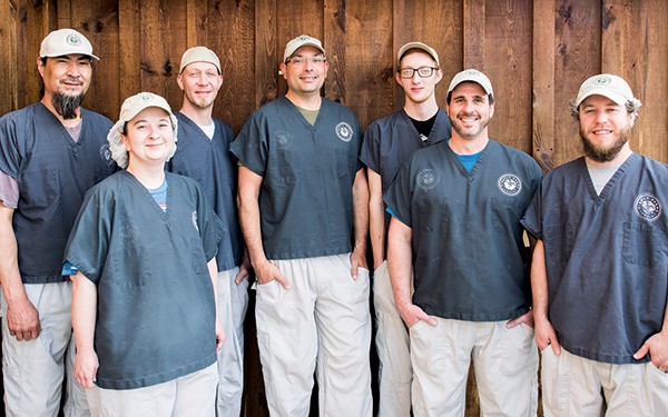 Director of operations Mike Cedro (center) stands with members of the cheesemaking team