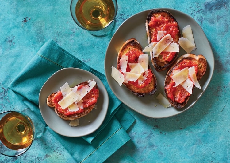 smashed tomato toasts with shaved garrotxa cheese