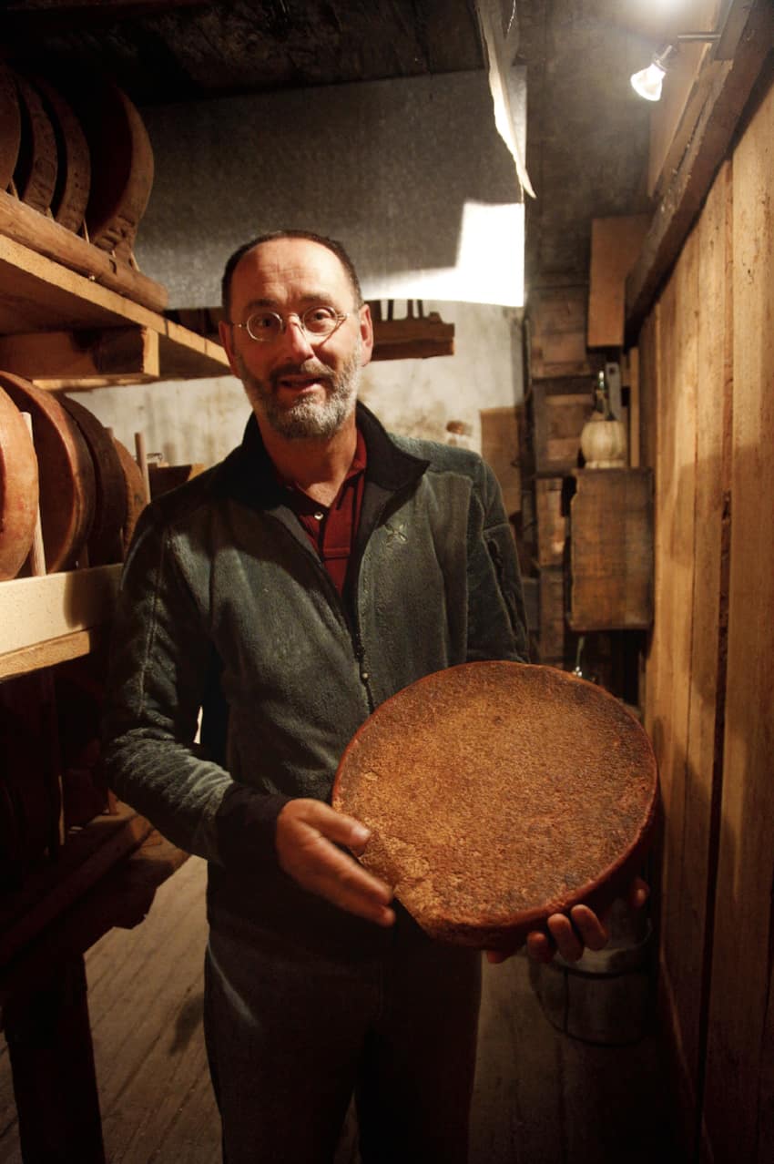 jean jacques zufferey with a wheel of the oldest cheese from the 19th century