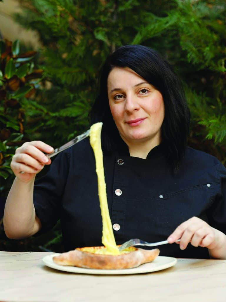 Tamara Chubinidze, owner of Manhattan’s Georgian restaurant Chama Mama, with her signature khachapuri.