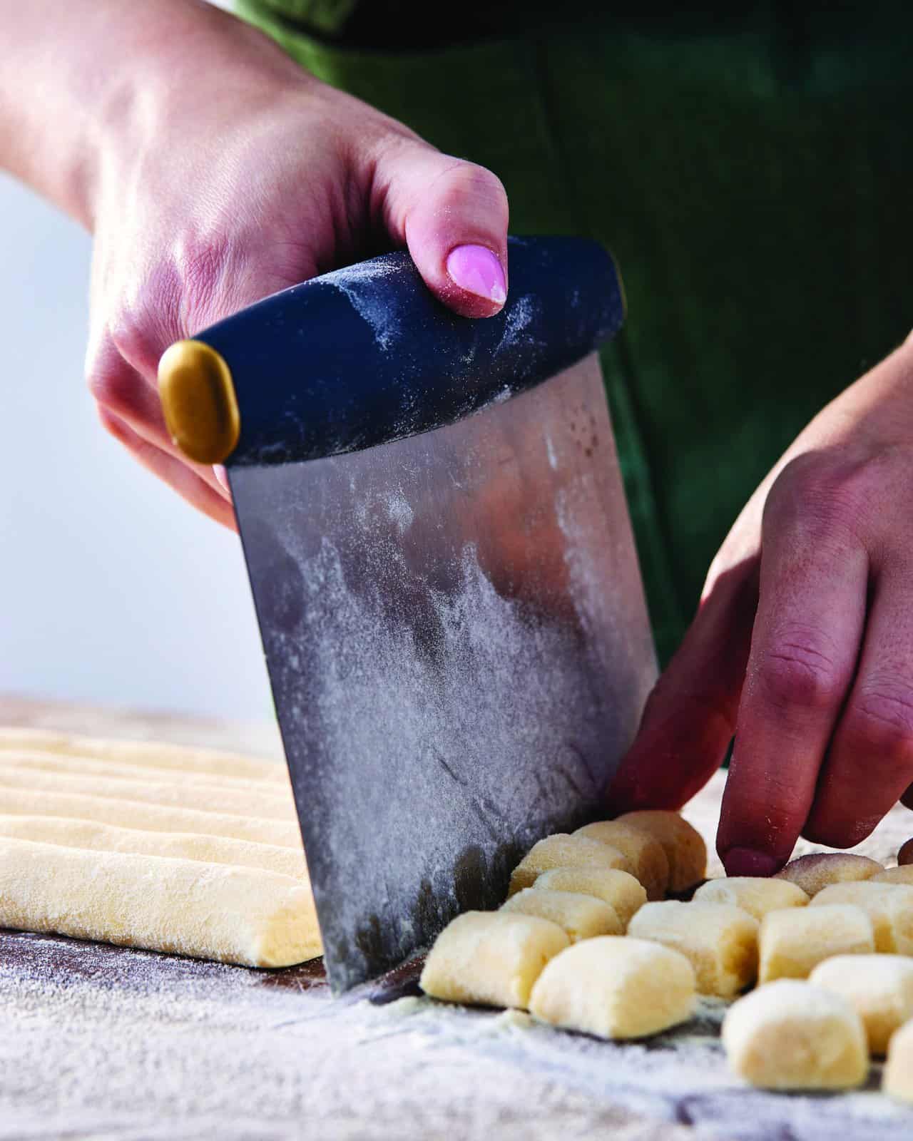 Gnocchi being shaped one by one.