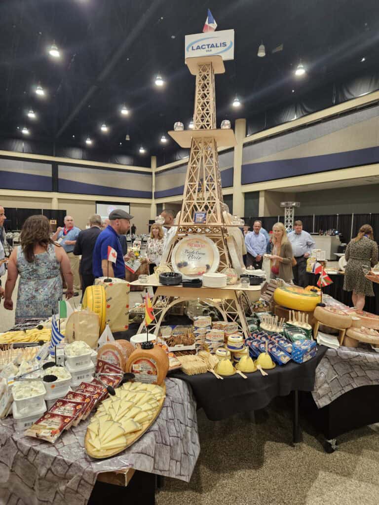 an eiffel tower replica packed with lactalis cheeses.